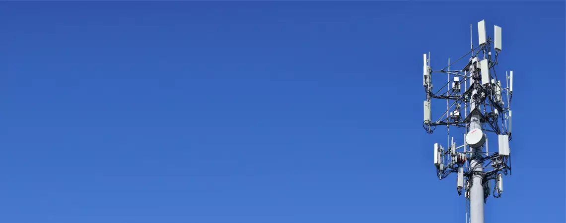 Telecommunication tower against a clear blue sky